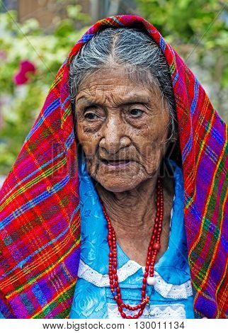PANCHIMALCO EL SALVADOR - MAY 08 : Portrait of an old Salvadoran woman during the Flower & Palm Festival in Panchimalco El Salvador on May 08 2016