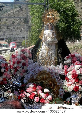 Alora Spain 24 April 2016: Religious procession crossing railway line near Alora Andalucia