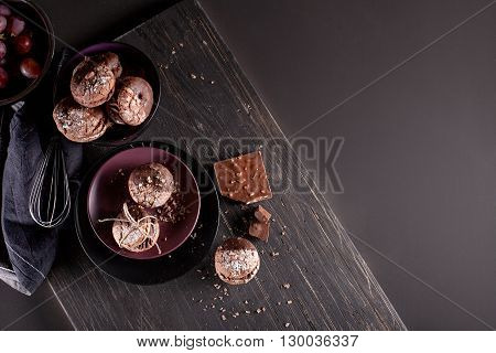 Italian maroni cookies with pieces of chocolate on old wooden background