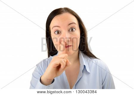 portrait of a young business woman with his finger in his nose against a white backgraound