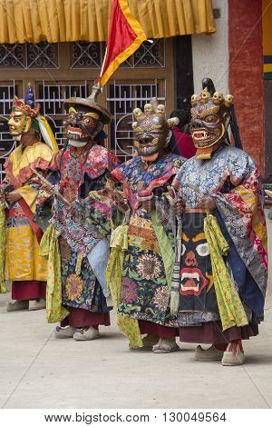 LAMAYURU INDIA - JUNE 13 2015: An unidentified buddhist lamas dressed in mystical mask dancing Tsam mystery dance in time of Yuru Kabgyat Buddhist festival at Lamayuru Gompa Ladakh North India