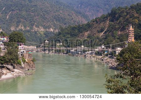 RISHIKESH INDIA - OCTOBER 20 2014 : Holy Ganges river that flows through Rishikesh (the world capital of Yoga) - the holy city for the Hindus India.