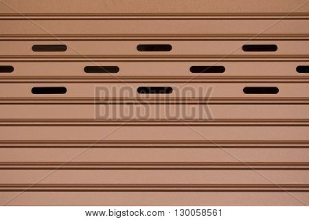 Texture of the metal gate with brown color.