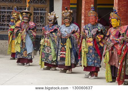 LAMAYURU INDIA - JUNE 13 2015: An unidentified buddhist lamas dressed in mystical mask dancing Tsam mystery dance in time of Yuru Kabgyat Buddhist festival at Lamayuru Gompa Ladakh North India