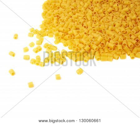 Pile of dry ditalini yellow pasta over isolated white background
