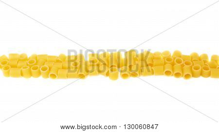 Line made of dry ditalini yellow pasta over isolated white background