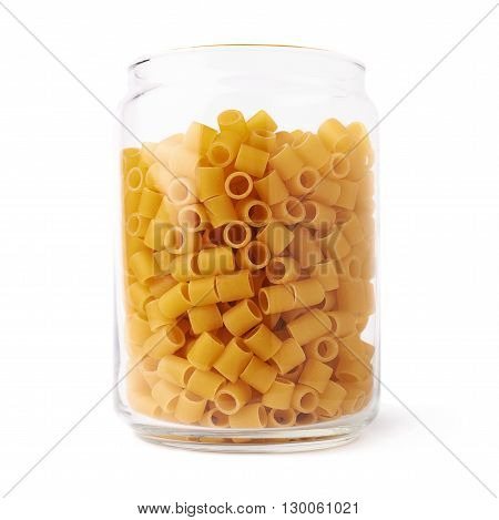 Glass jar filled with dry ditalini yellow pasta over isolated white background