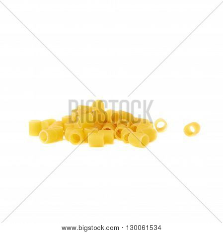 Pile of dry ditalini yellow pasta over isolated white background