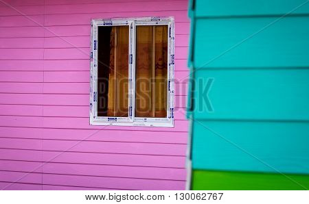 Glass windows white border Bright pink walls