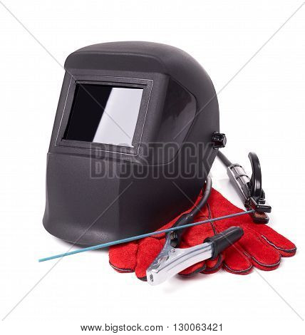 Welding equipment isolated on a white background, welding mask, leather gloves, welding electrodes, high-voltage wires with clips, set of accessories for arc welding.