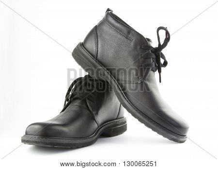 Boots isolated. Black shoes isolated on white background