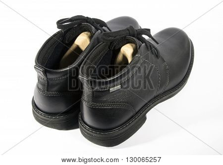 Boots isolated. Black shoes isolated on white background