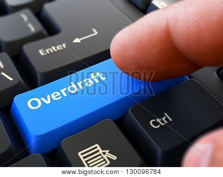 Computer User Presses Blue Button Overdraft on Black Keyboard. Closeup View. Blurred Background. 3D Render.