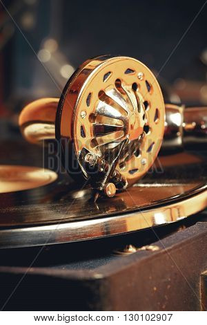 Old record player gramophone needle on record closeup. vintage toning