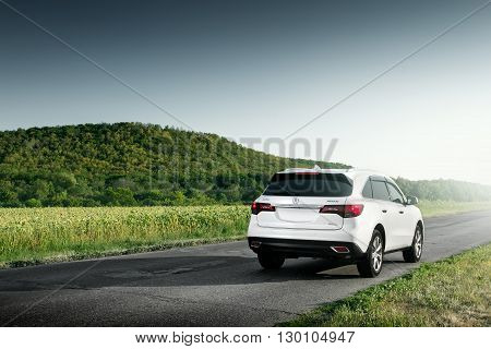 Saratov, Russia - August 11, 2015: Modern car Acura MDX standing on road at sunset