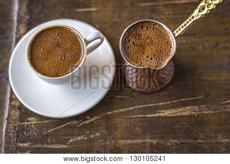 Turkish coffee and coffee pot on wooden background. Top View