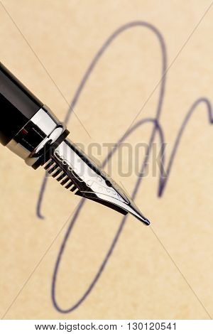 signature and a fountain pen