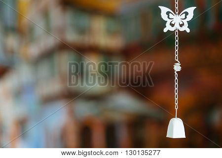 Closeup of silver bell in butterfly shaped