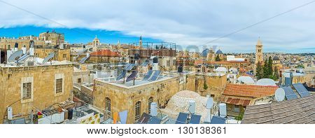 The medieval roofs of the stone houses in Armenian Quarter with the numerous satellites and solar panels Jerusalem Israel.