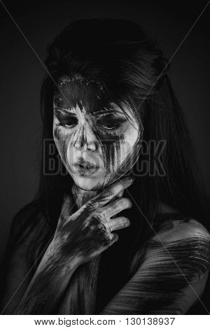 Scary portrait of the woman. Self-damage, self-destruction, suicide idea. Black-and-white Version of the Image