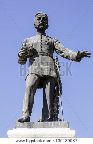 Aranjuez Spain - March 13 2016: In Aranjuez the first statue to the King of Spain. D. Alfonso XII. Situated on a base of stone doors Market of Aranjuez in Madrid