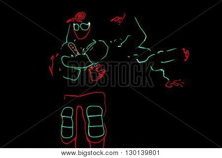 Dancers Crew In Led Suits On Dark Background, Colored Show