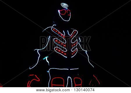 Dancers Crew In Led Suits On Dark Background, Colored Show
