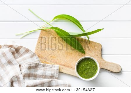 Fresh ramsons leaves. Wild garlic leaves and tasty pesto. Healthy vegetable.