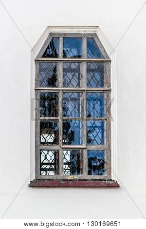 Photo from an old window on white facade of the Monastery