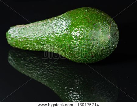fresh fruit avocado fruit on black background