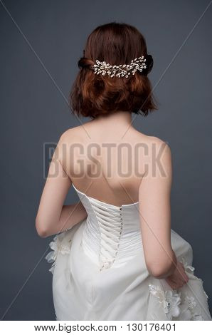 Bridal fashion. View from the back. Strapless dress with lacing.
