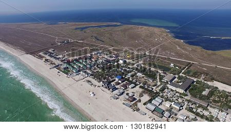 AERIAL: Luxury island resort on exotic white sand beach