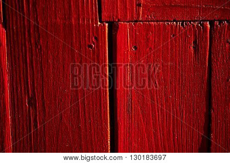 painted old wooden wall. red fence paint