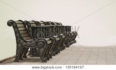 Several benches standing in a row in parke.