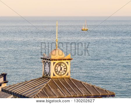 Old clock on a tower of Eastbourne's historical Victorian Pier