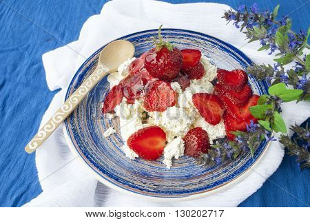 dish of cottage cheese and strawberries, diet breakfast, healthy food.