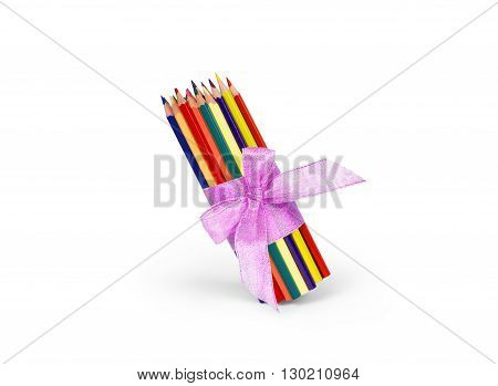Color pencils isolated on white background with a bow