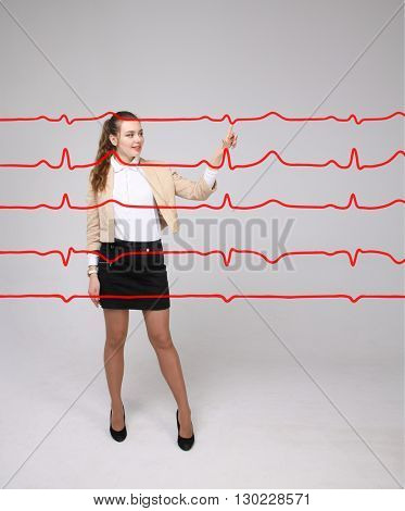 Doctor woman working with cardiogram lines