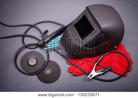Welding equipment, welding mask, protective leather gloves, welding electrodes, high-voltage wires with clamps, cutting disc for grinder, set of accessories for arc welding.