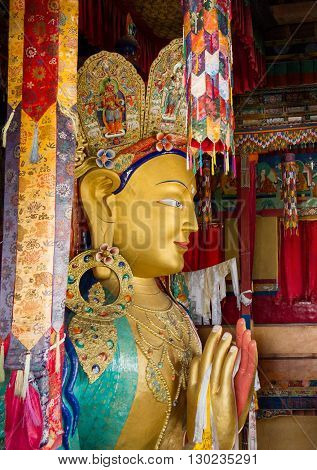 Upper part of the Giant statue of Maitreya Buddha (the largest statue in Ladakh which occupies two floors of the building) in the Thikse Monastery near Leh (Ladakh Jammu and Kashmir north India)