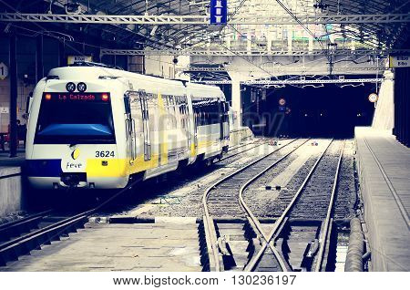 Bilbao Spain - June 10 2010: Passenger diesel train of Feve railway company stands at the underground station. Feve railway connects Hendaye (France) and Ferrol (northwest Spain).