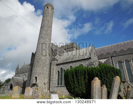 An ancient church sits on a hill above the town it protects, harboring former residents grave sites.