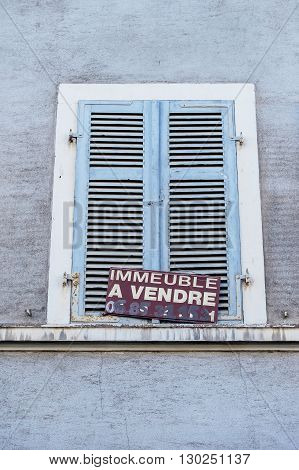 MULHOUSE FRANCE - DEC 19 2015: Building for sale - Immeuble a vendre announce on a building in the French city of Mulhouse
