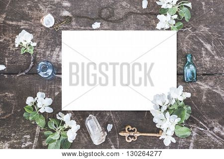 Stylish branding mockup with flowers, jars and crystalls to display your artworks. Cute vintage mock up on wooden background.