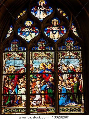PARIS, FRANCE - MAY 31, 2015 Jesus Christ Children Suffer the Little children to come to me Angels Stained Glass Saint Severin Church Paris France. Saint Severin one of oldest churches Paris located in the Latin Quarter. Built in the 1500s