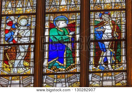 PARIS, FRANCE - MAY 31, 2015 Saint Sebastian Saint t Patrick Risen Jesus Christ Stained Glass Saint Severin Church Paris France. Saint Severin one of oldest churches Paris located in the Latin Quarter. Built in the 1500s