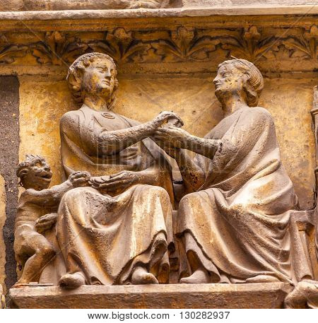 Man Woman Devil Statues Exterior Saint Severin Church Paris France. Saint Severin one of oldest churches Paris located in the Latin Quarter. Built in the 1500s