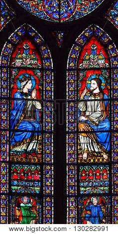PARIS, FRANCE - MAY 31, 2015 Jesus Christ Mary Angels Stained Glass Notre Dame Cathedral Paris France. Notre Dame was built between 1163 and 1250AD.
