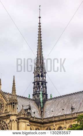 Black Spire Facade Tower Overcast Skies Notre Dame Cathedral Paris France. Notre Dame was built between 1163 and 1250 AD. Black Spire erected in the 1850s.