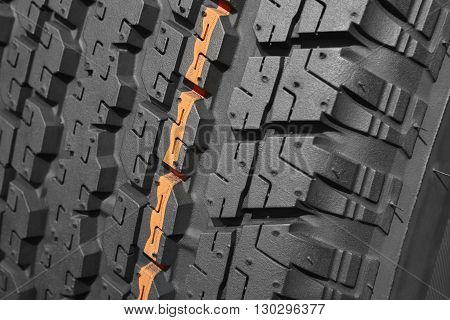Brand new all terrain tyre macro detail. Vehicle wheel. Horizontal